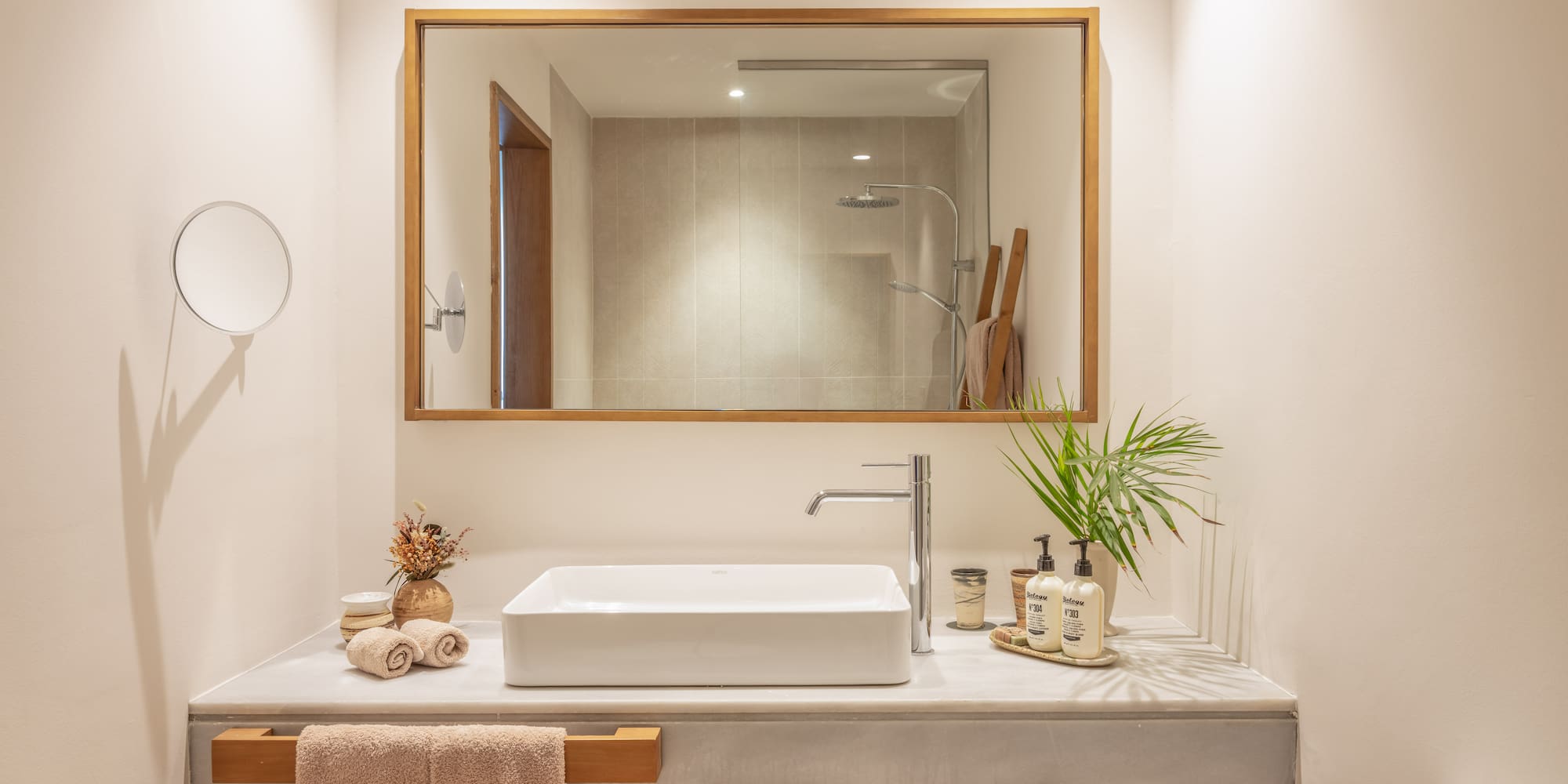 a bathroom with a mirror and sink