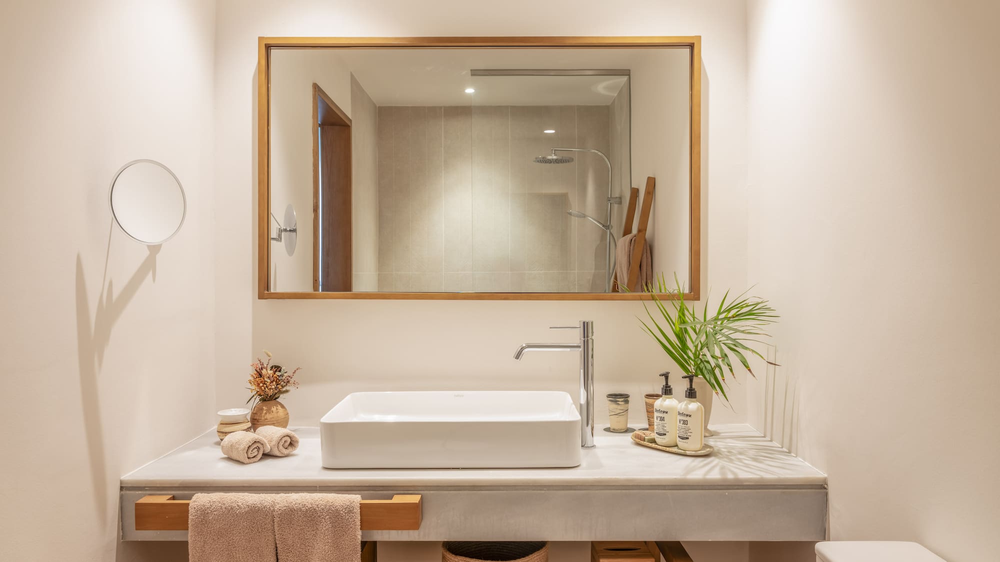 a bathroom with a mirror and sink