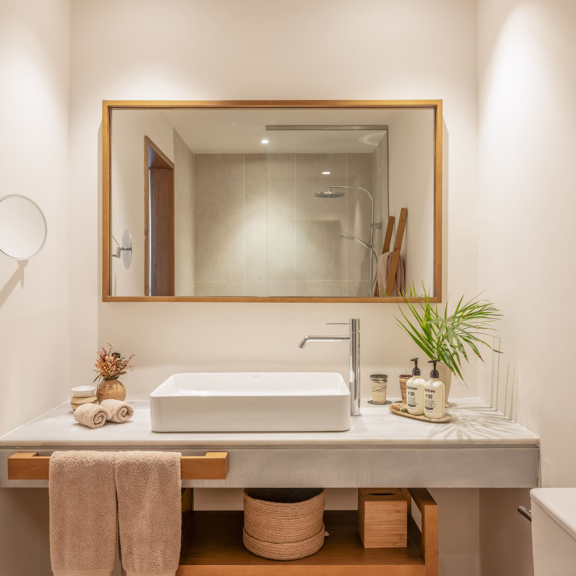 a bathroom with a mirror and sink