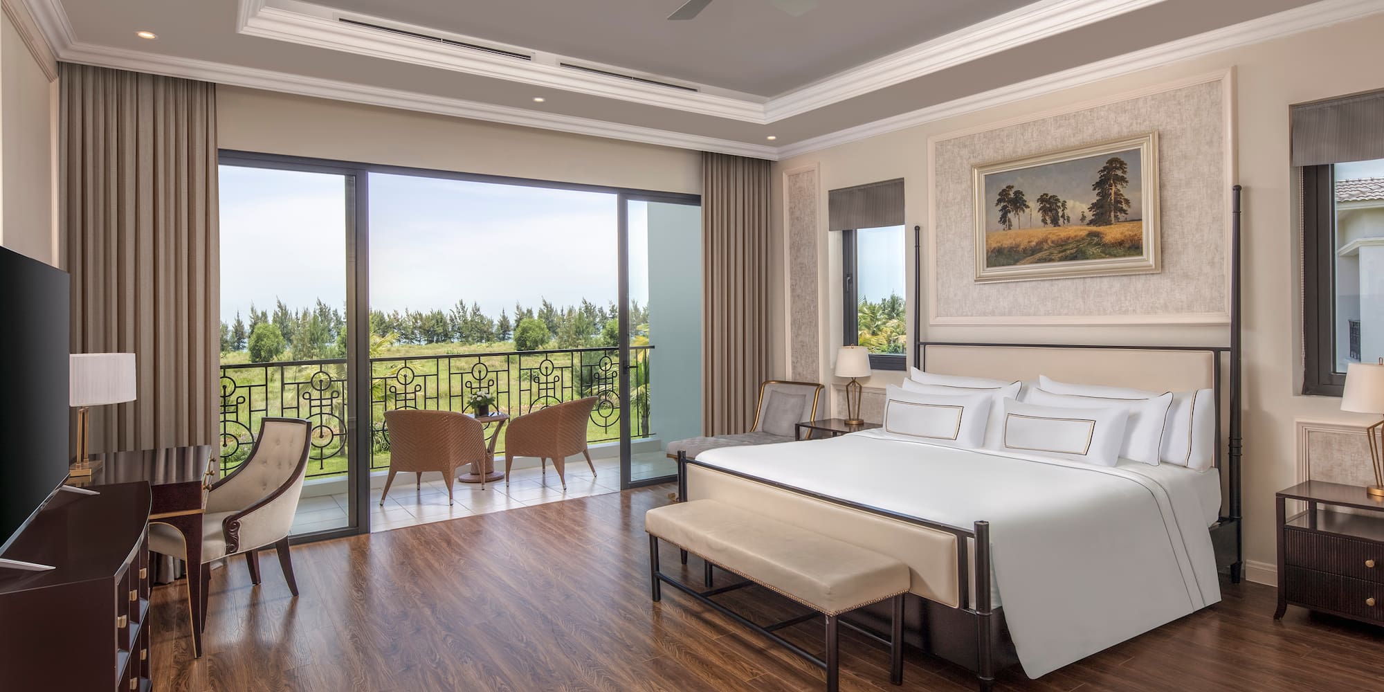 a bedroom with a bed and chairs