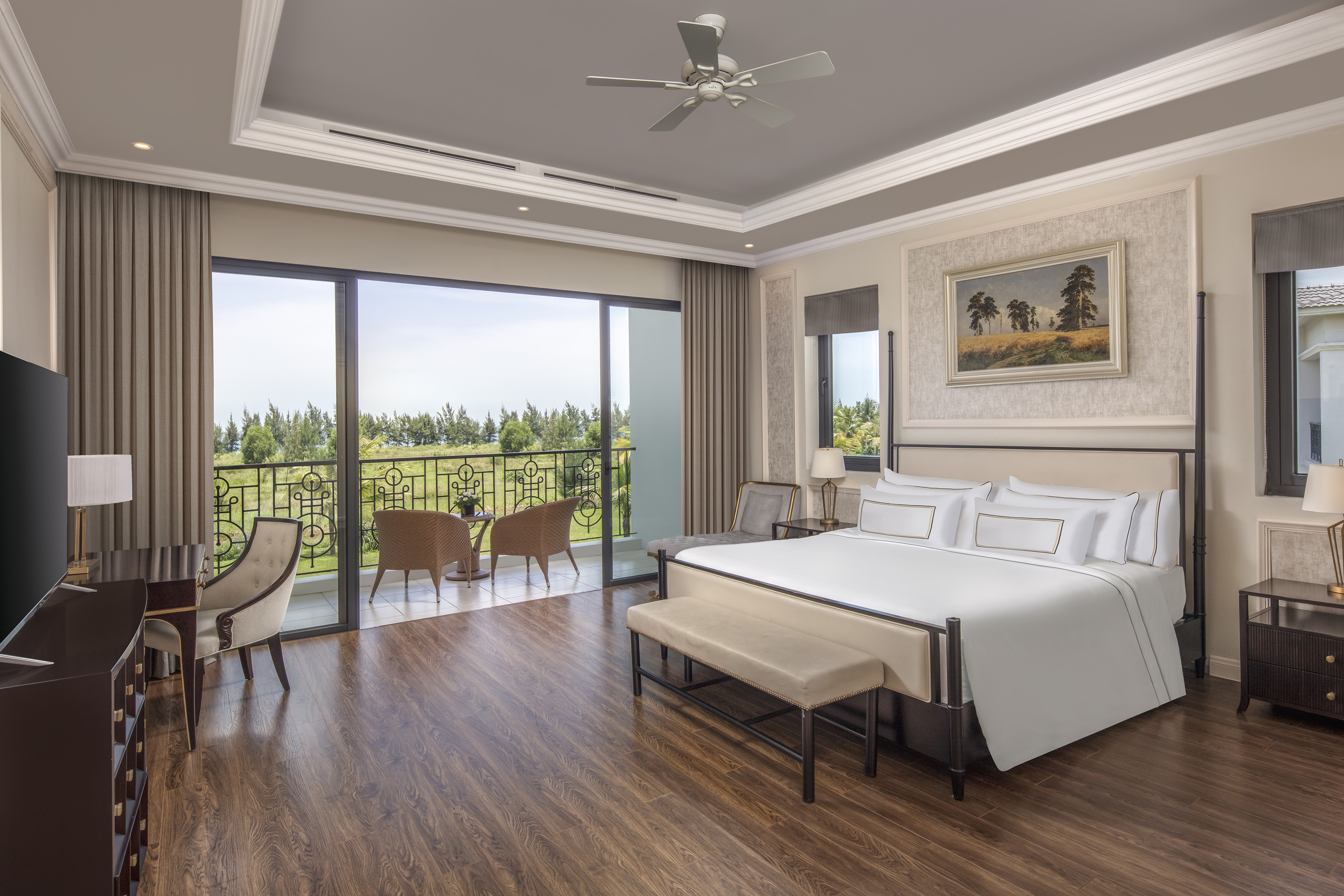 a bedroom with a bed and chairs