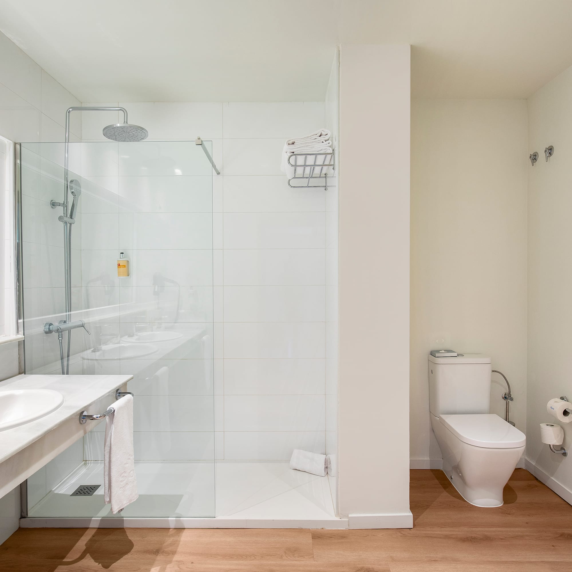 a bathroom with a glass shower and sink
