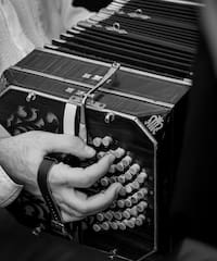 a person playing an accordion