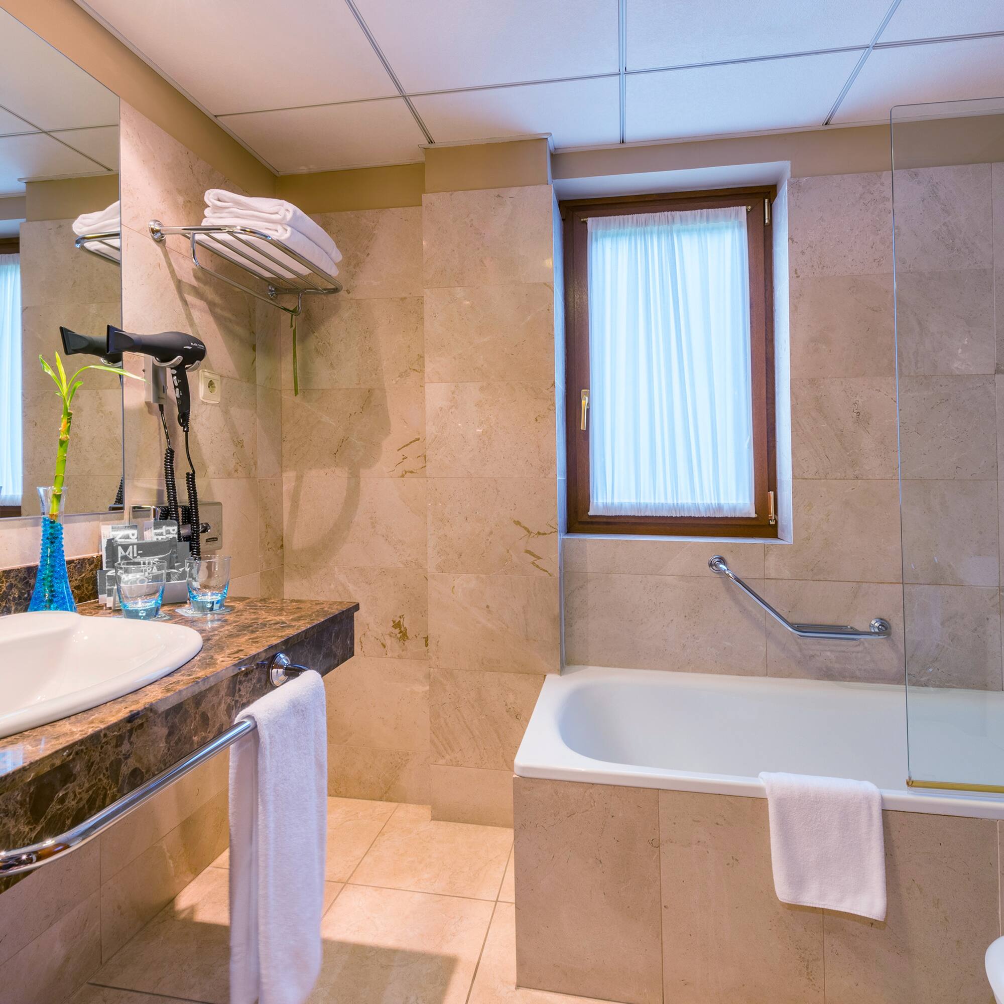 a bathroom with a sink and bathtub