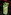 Cucumber mint cocktail with ice in a textured glass, bar setting.