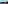 a beach with a body of water and a hill