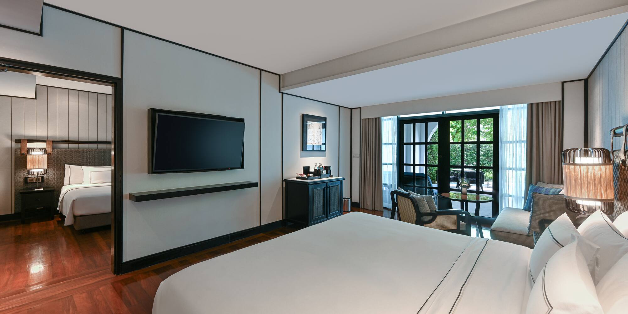 a room with a bed and a television