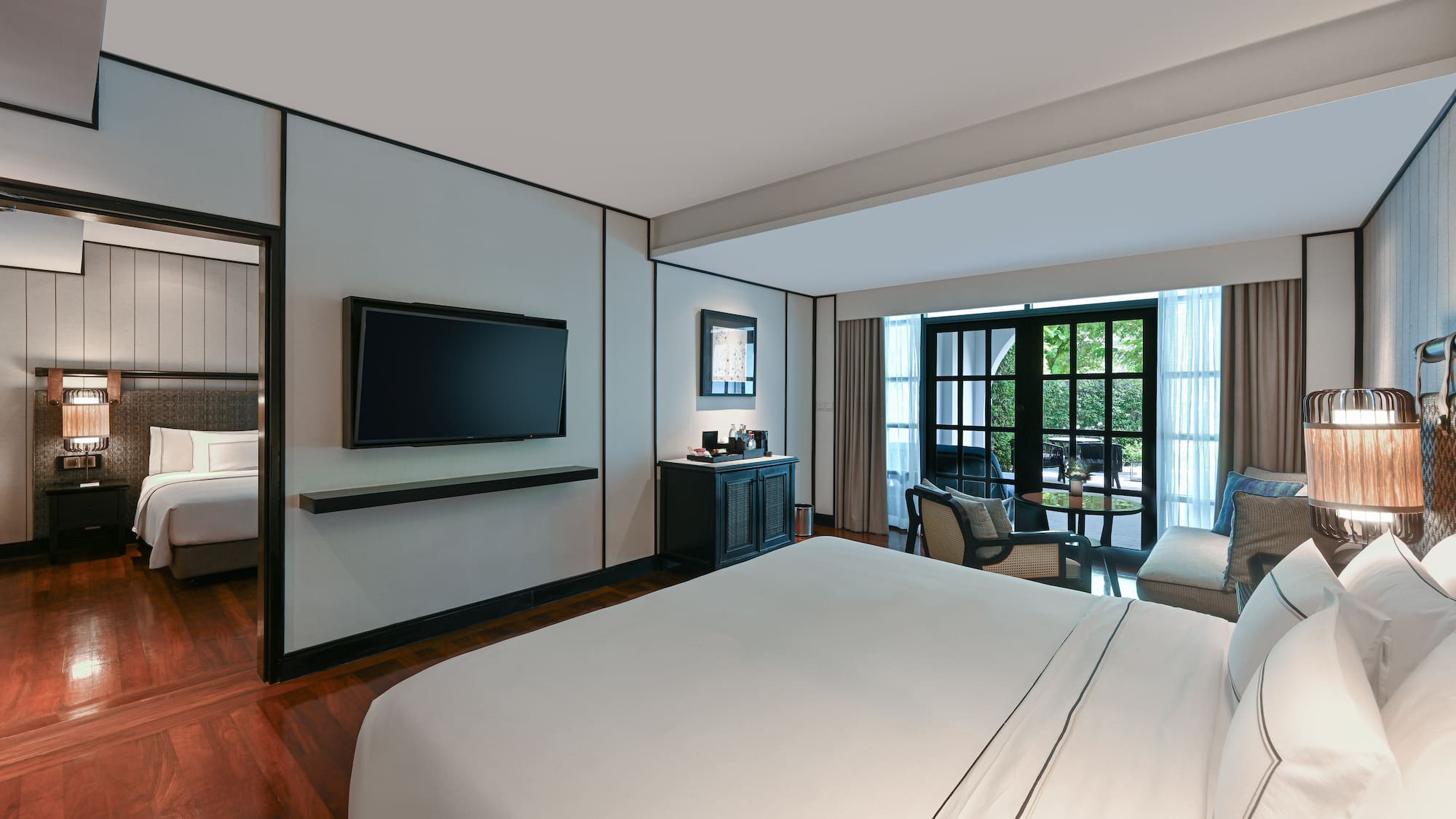 a room with a bed and a television