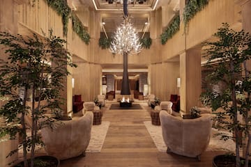 a room with a chandelier and a fire