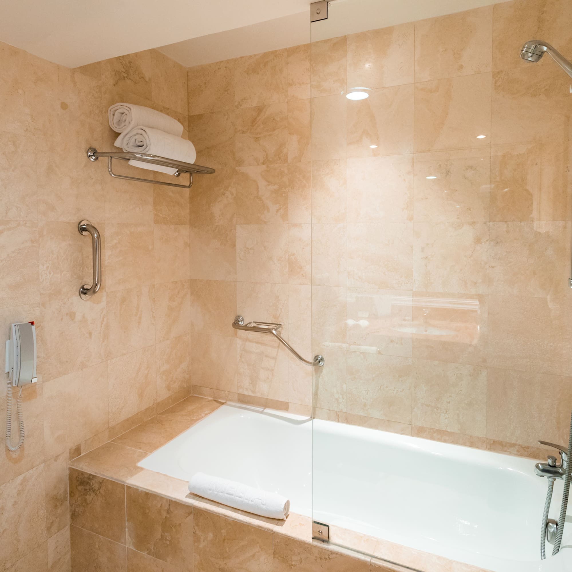 a bathroom with a bathtub and shower
