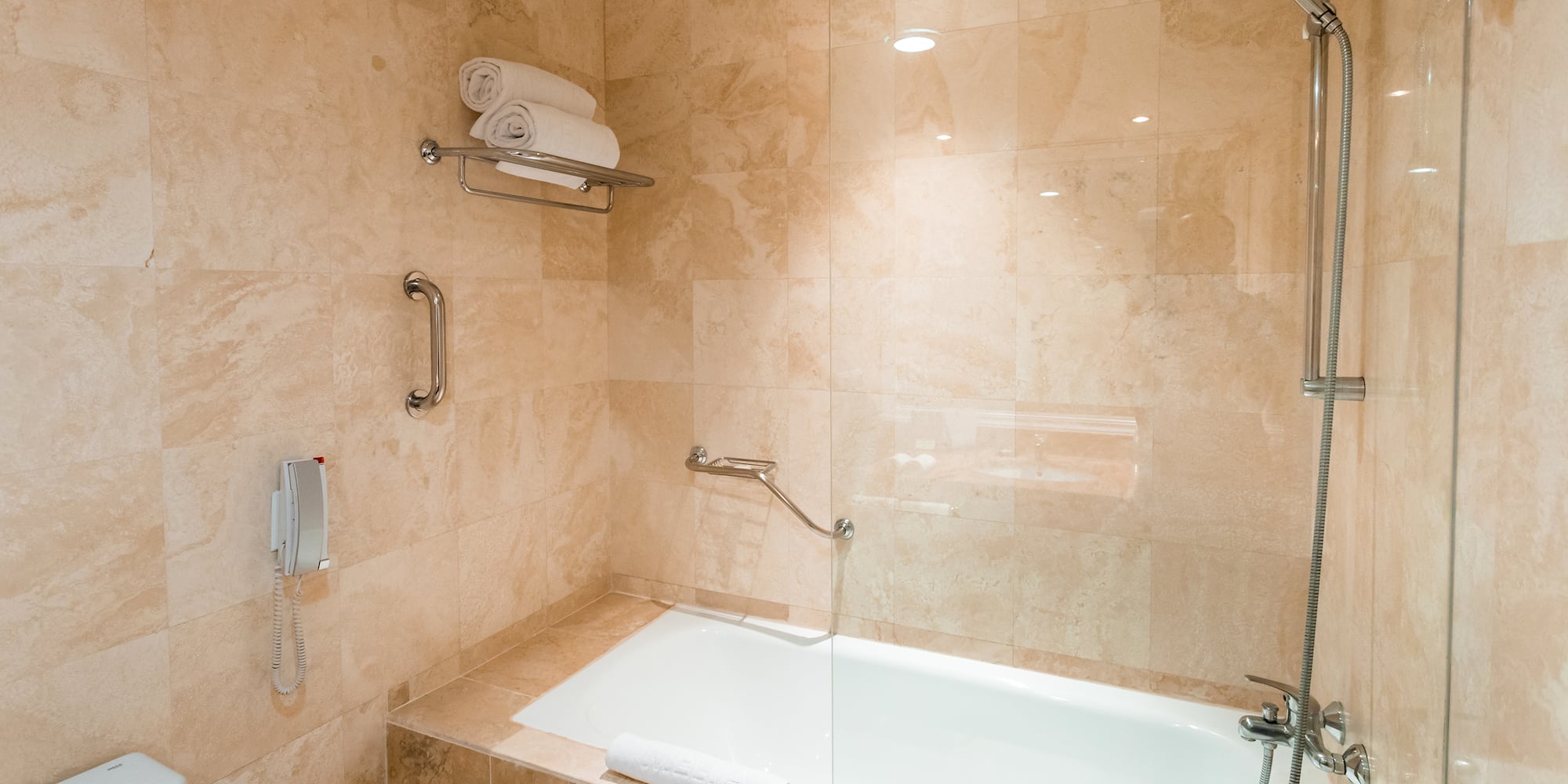 a bathroom with a bathtub and shower