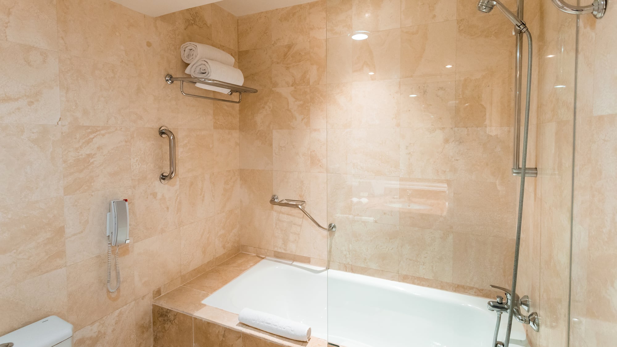 a bathroom with a bathtub and shower