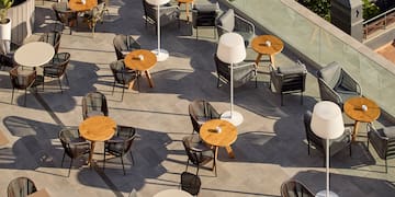 a group of tables and chairs on a patio