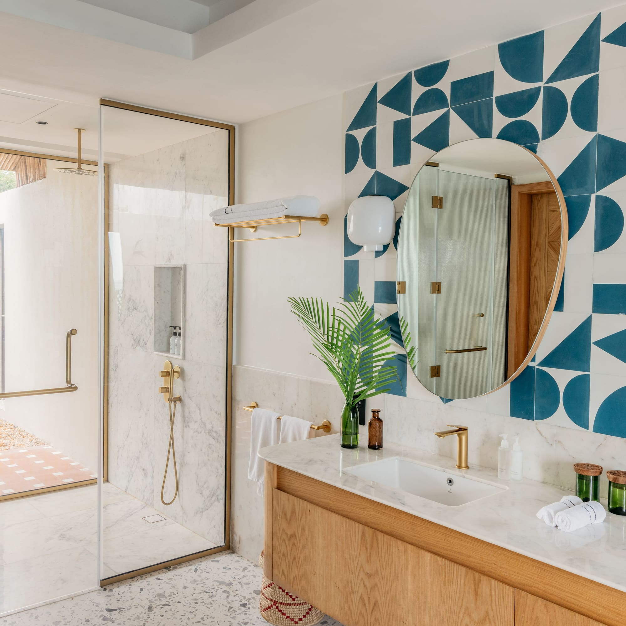 a bathroom with a shower and a mirror