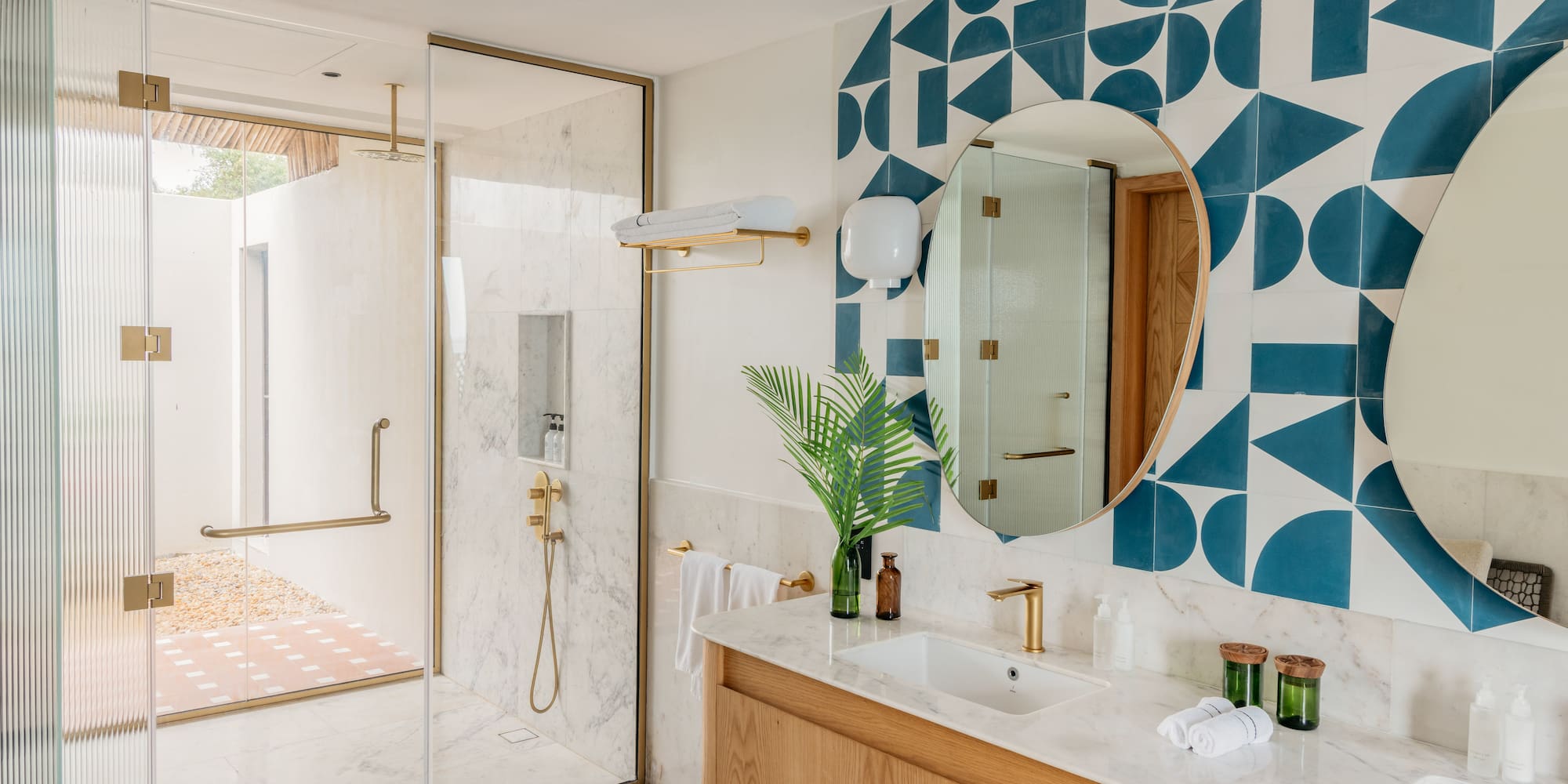 a bathroom with a shower and a mirror