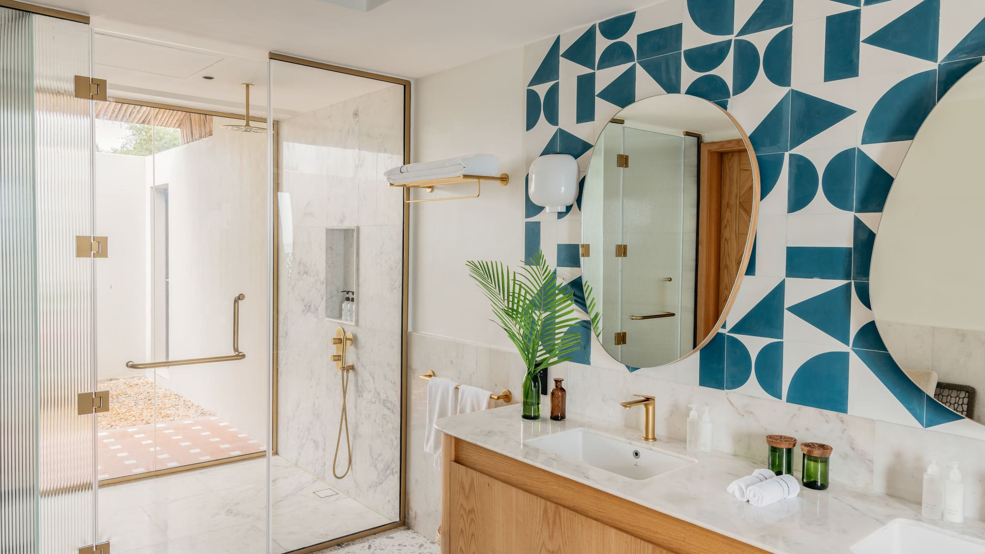 a bathroom with a shower and a mirror