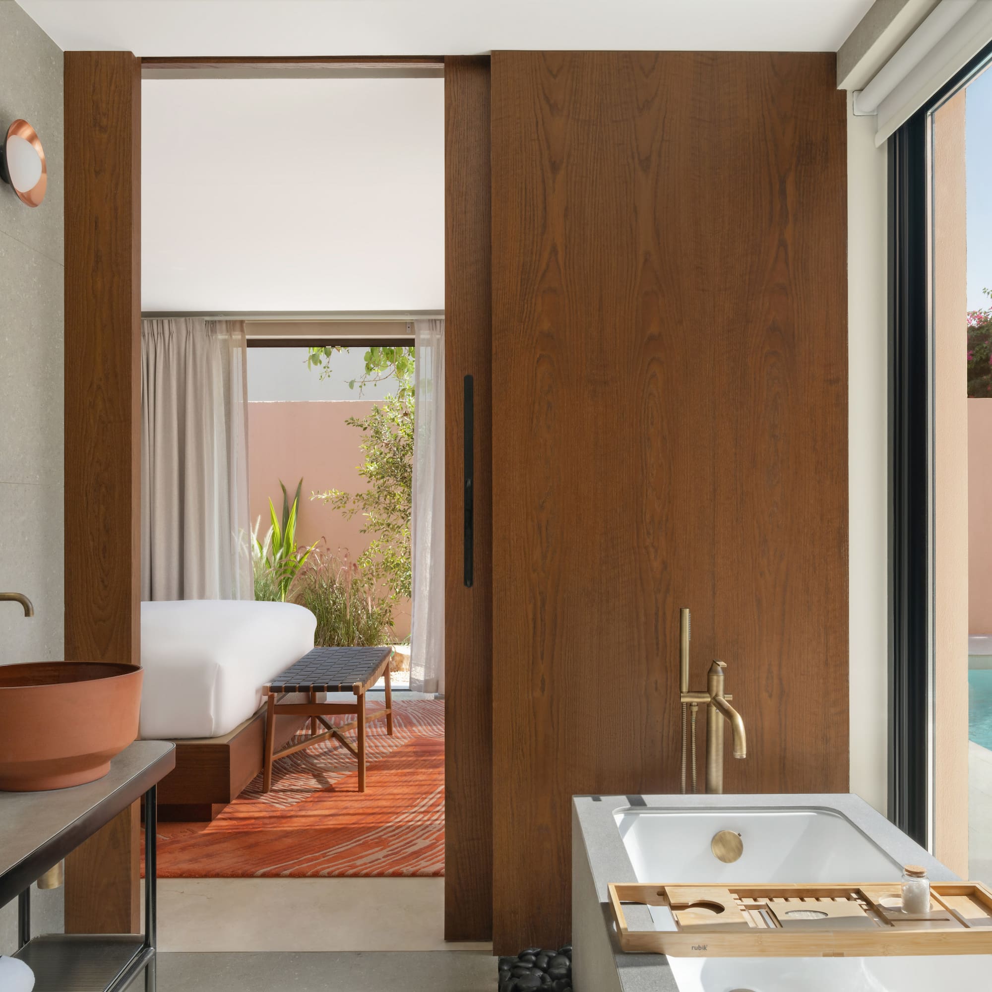 a bathroom with a pool and a sink