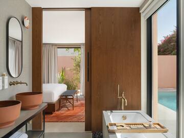 a bathroom with a pool and a sink
