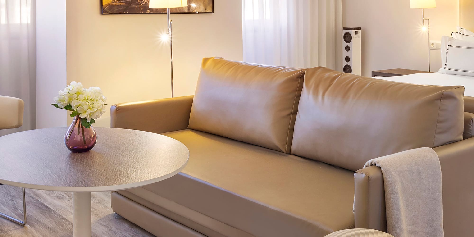 a living room with a couch and a table