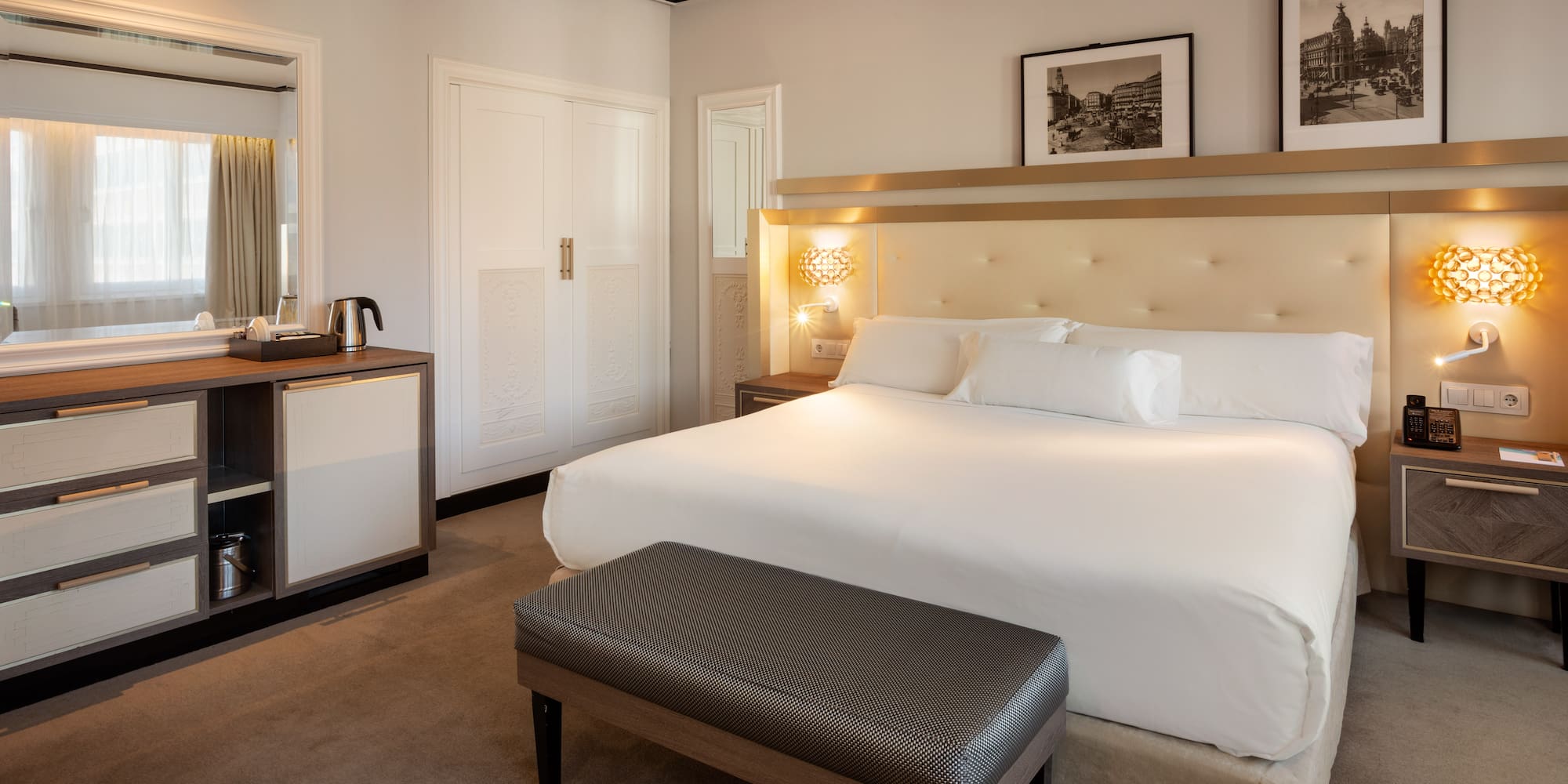 a bedroom with a bed and a mirror