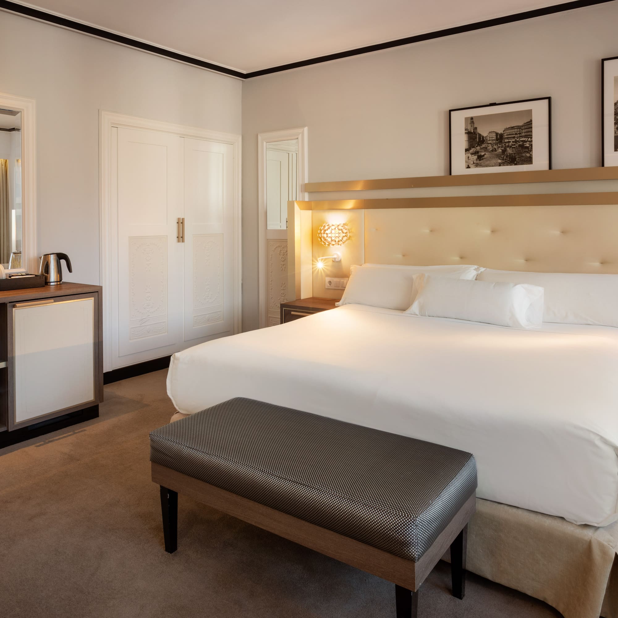 a bedroom with a bed and a mirror