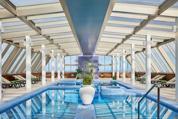 a indoor pool with a plant in it