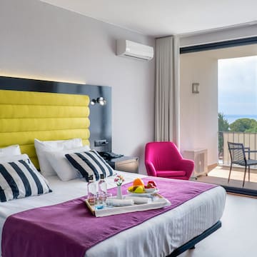 a bed with a tray of food on it