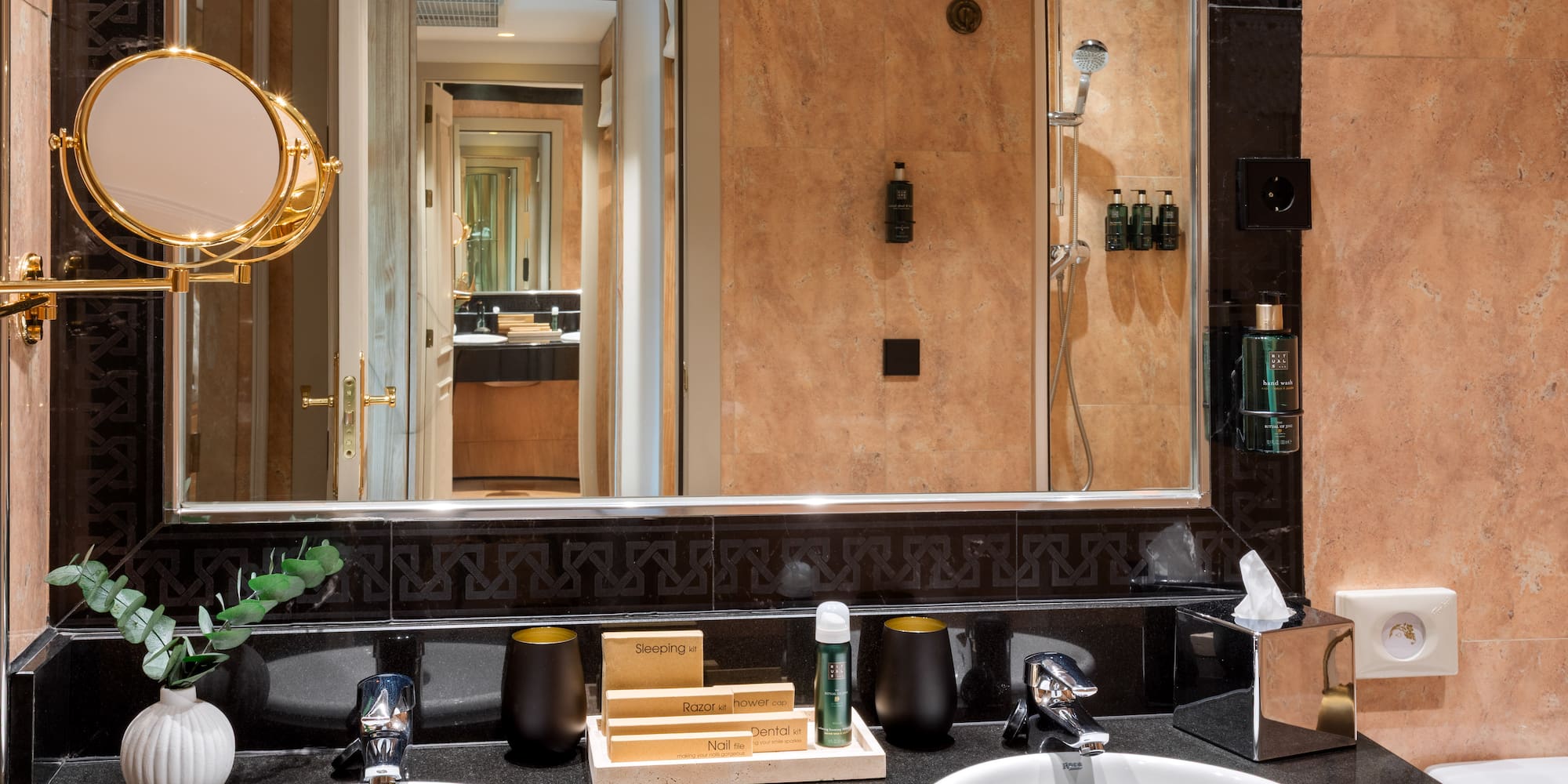 a bathroom with a mirror and sinks