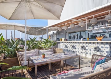 a patio with a table and chairs