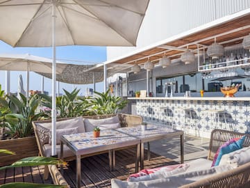 a patio with a table and chairs