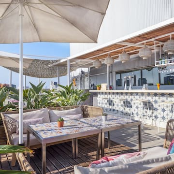 a patio with a table and chairs