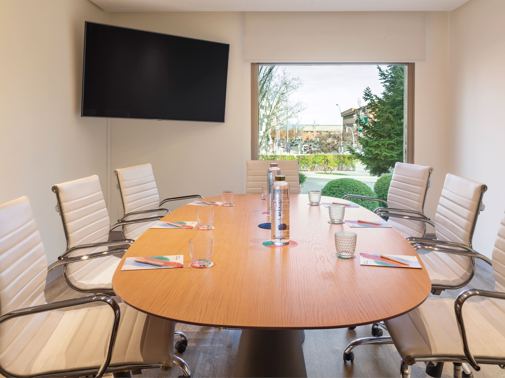 a conference room with a table and chairs