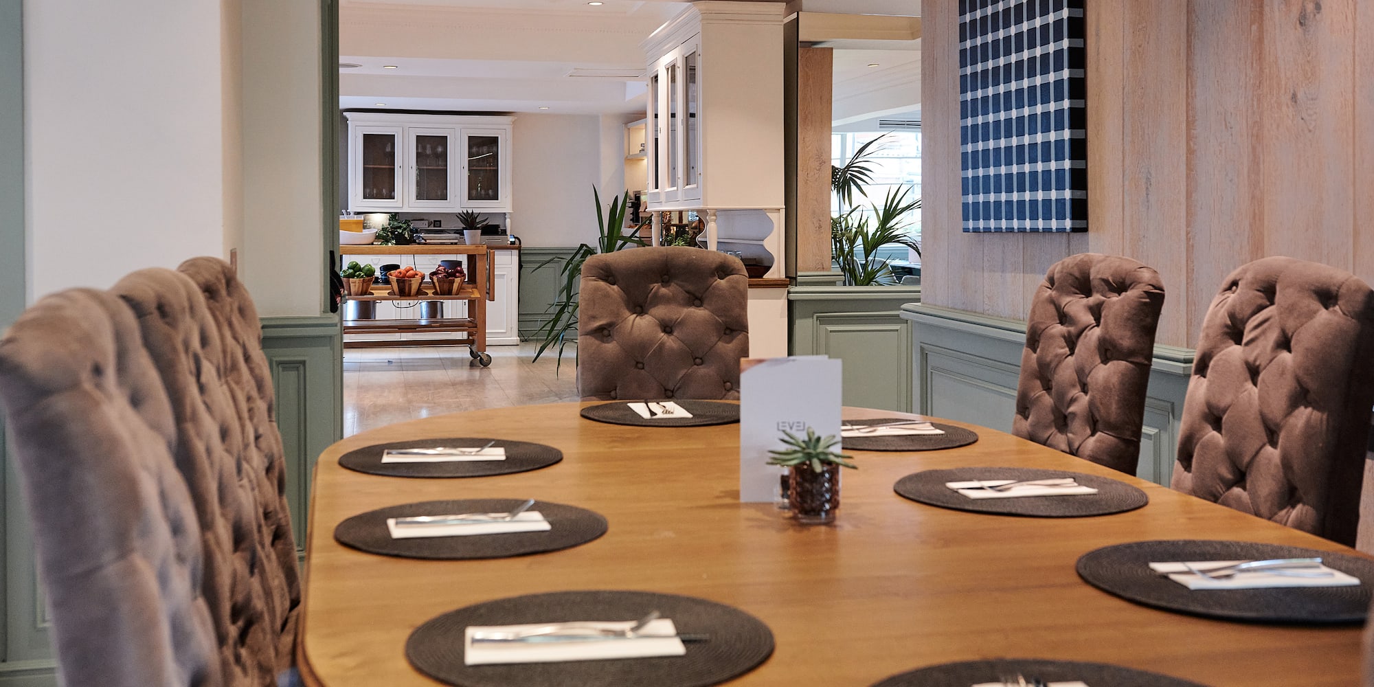 a table with chairs and plates on it