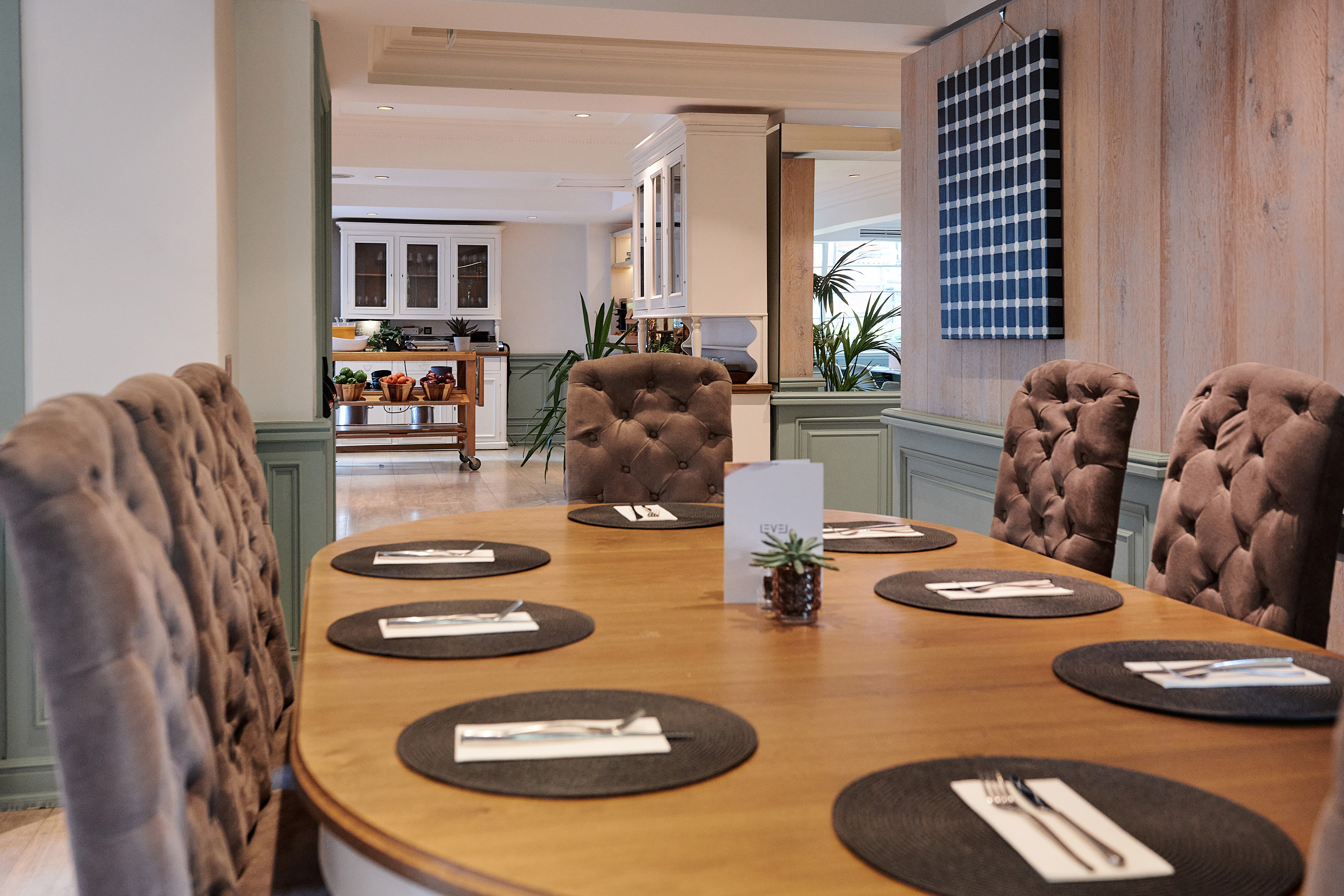 a table with chairs and plates on it