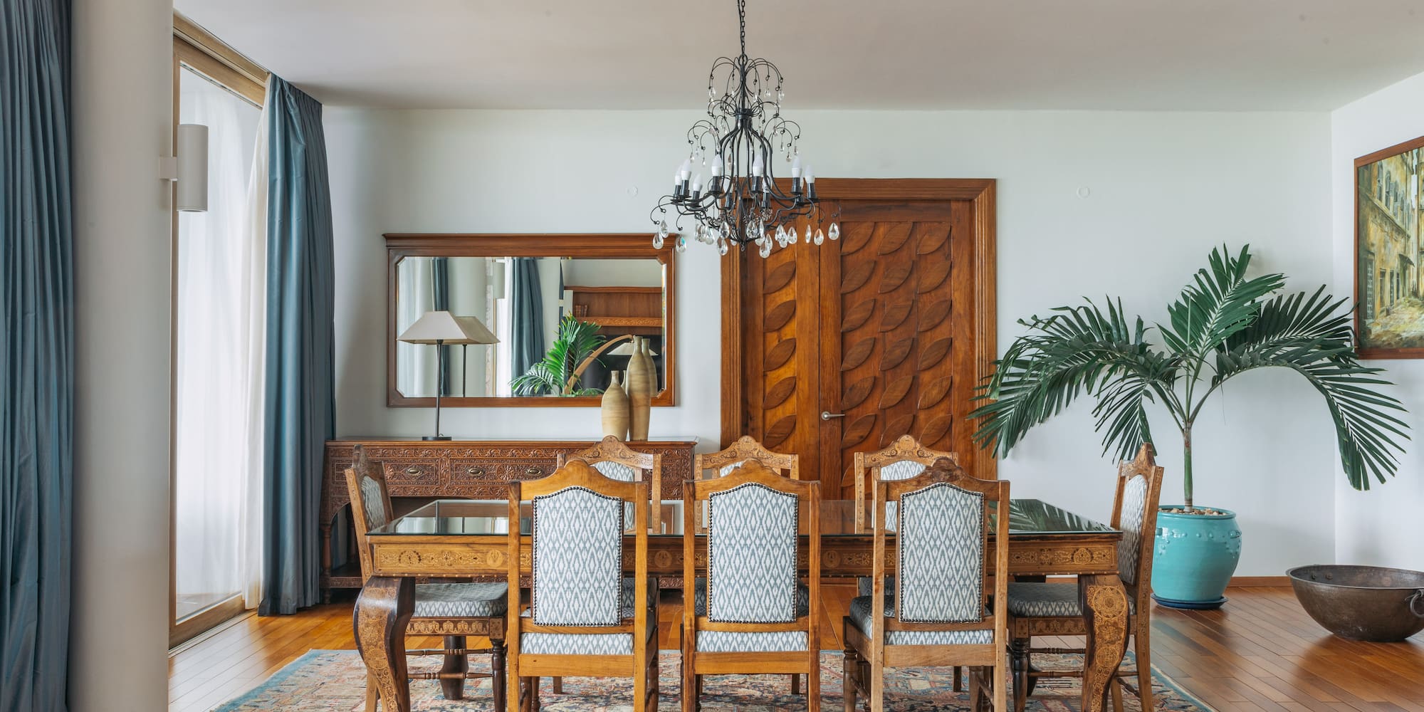 a dining room with a table and chairs