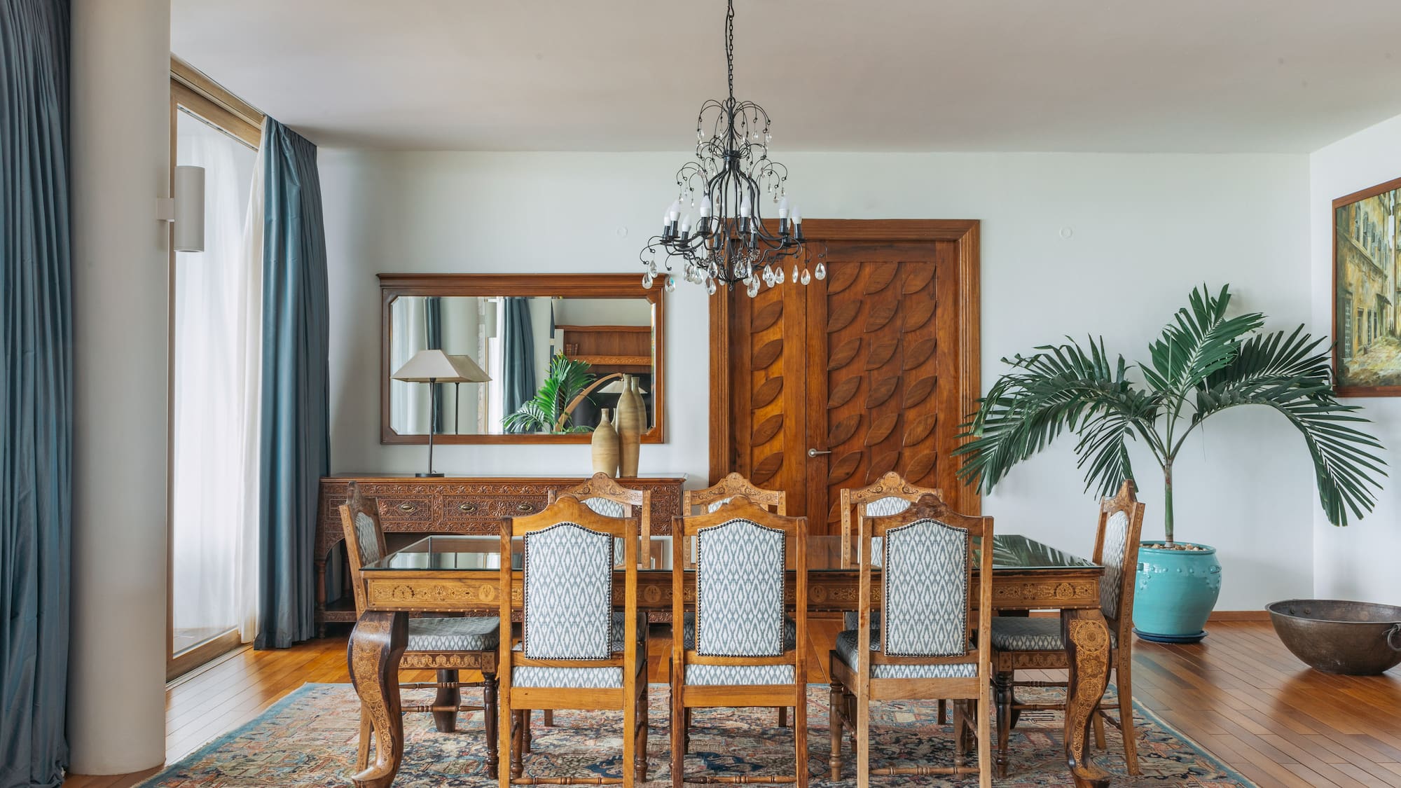 a dining room with a table and chairs