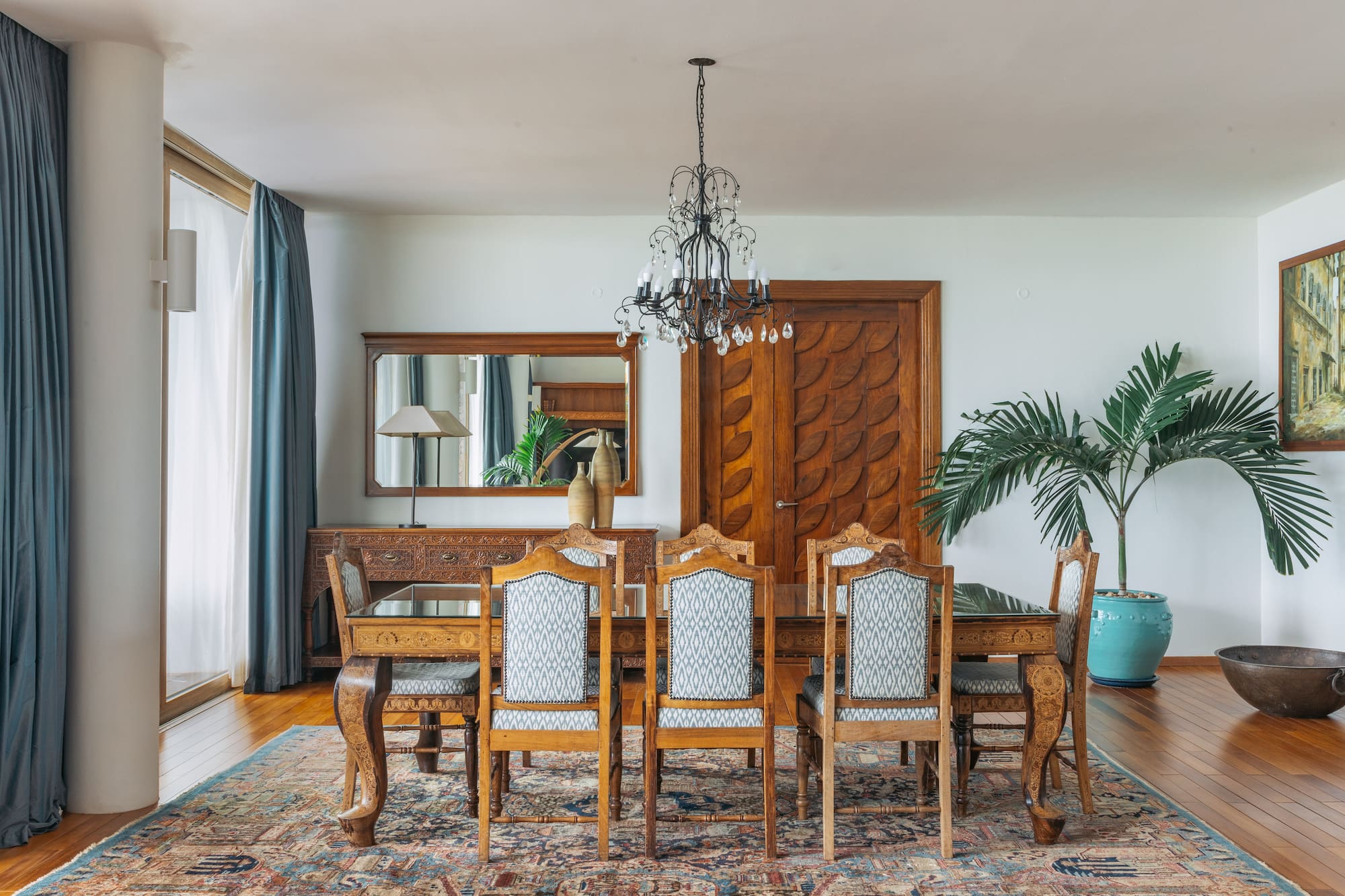 a dining room with a table and chairs