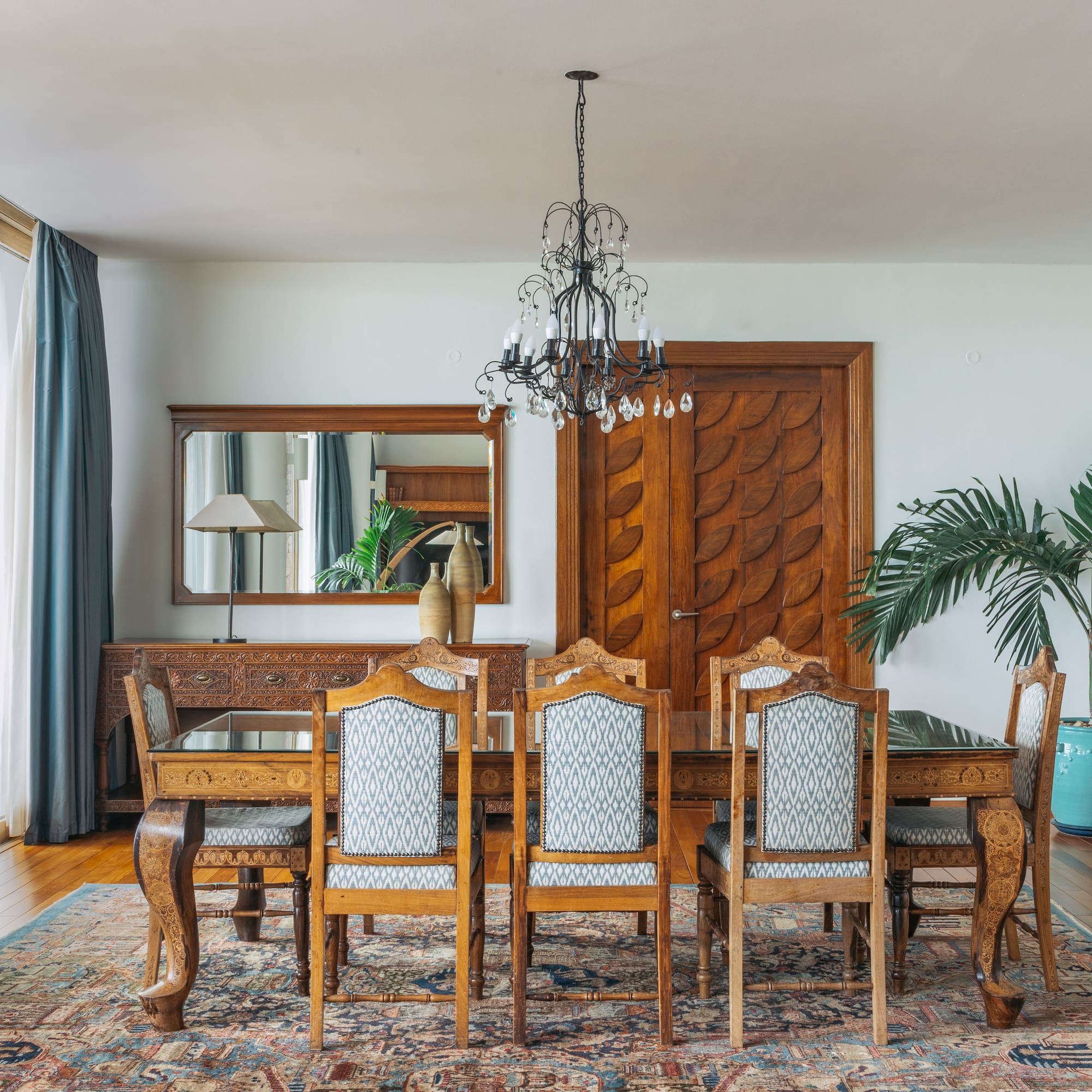 a dining room with a table and chairs