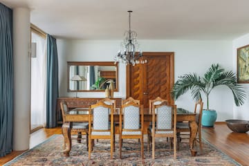 a dining room with a table and chairs