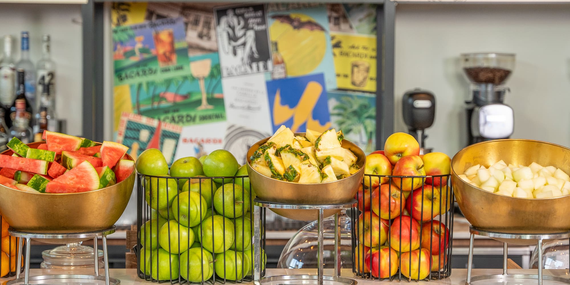 a group of fruit in metal bowls