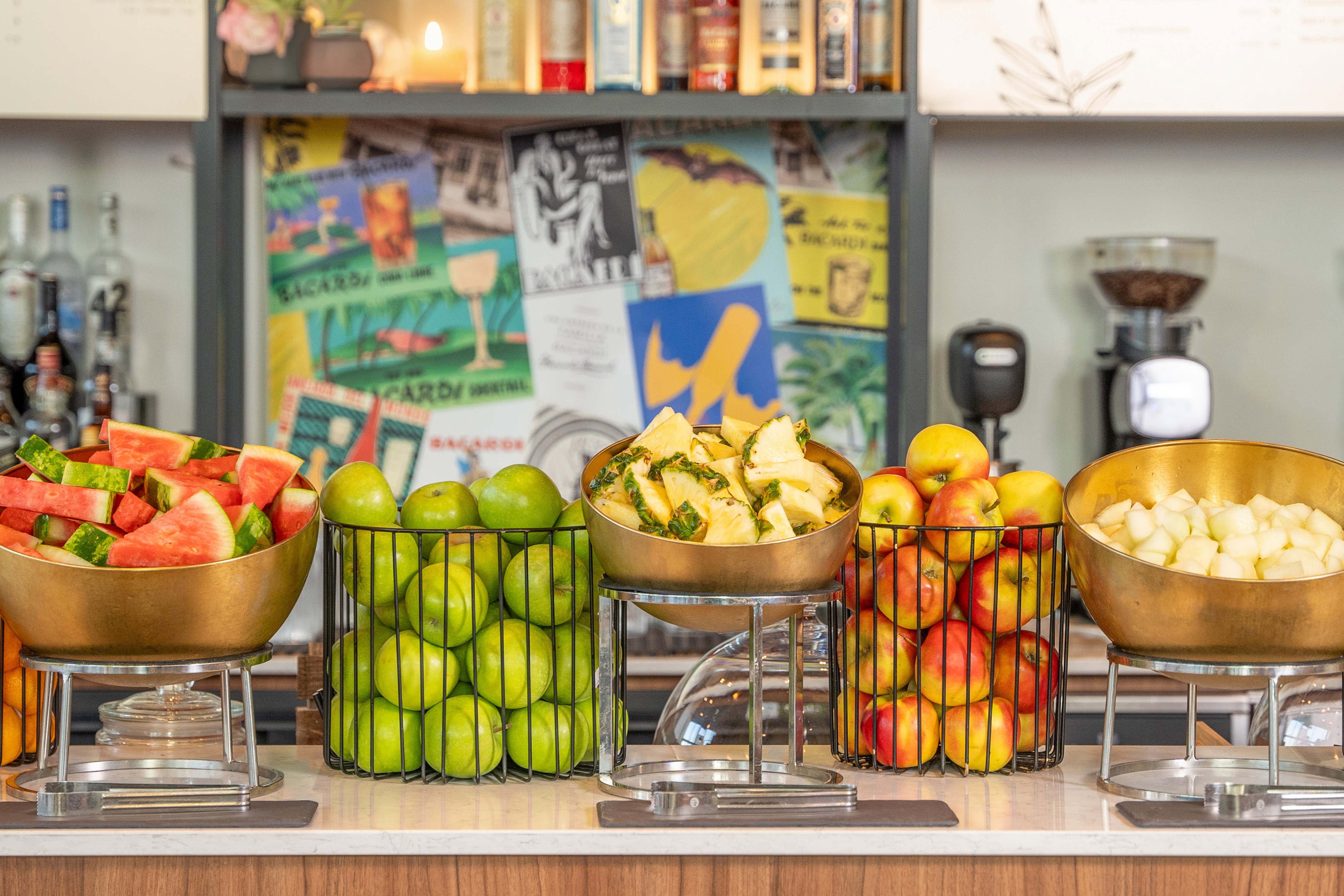 a group of fruit in metal bowls