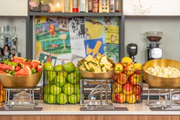 a group of fruit in metal bowls