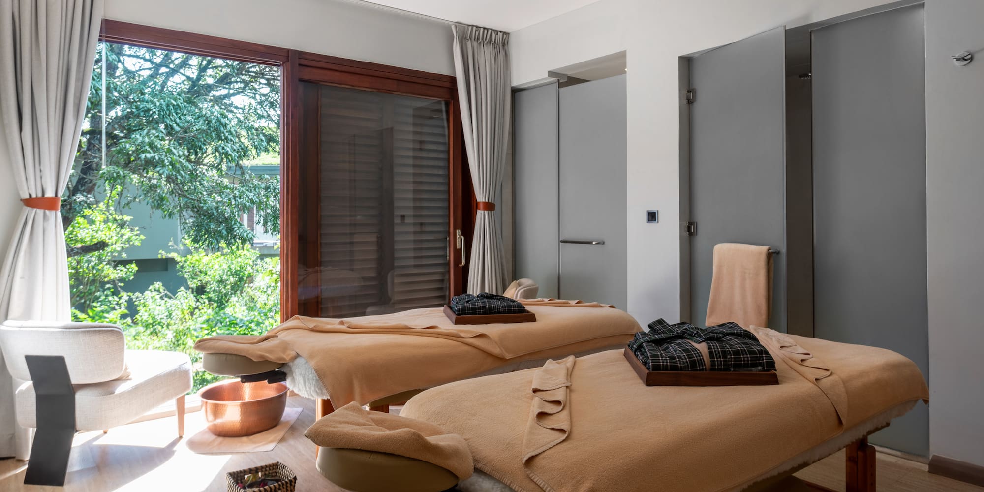 a room with massage tables and chairs