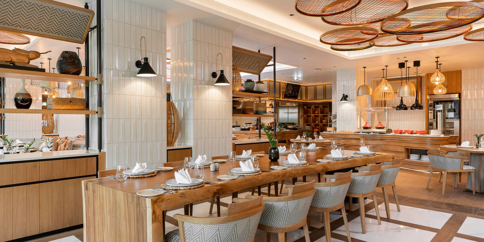 a restaurant with a long table and chairs