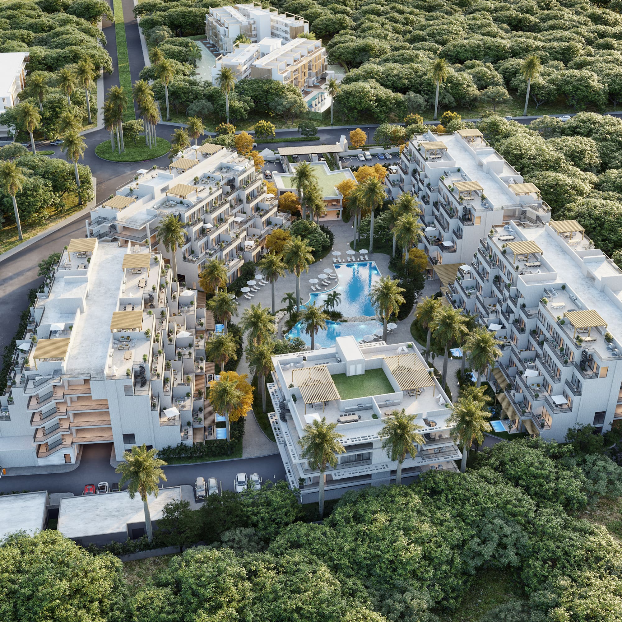 Vista aérea de complejo moderno con piscina, palmeras y selva.