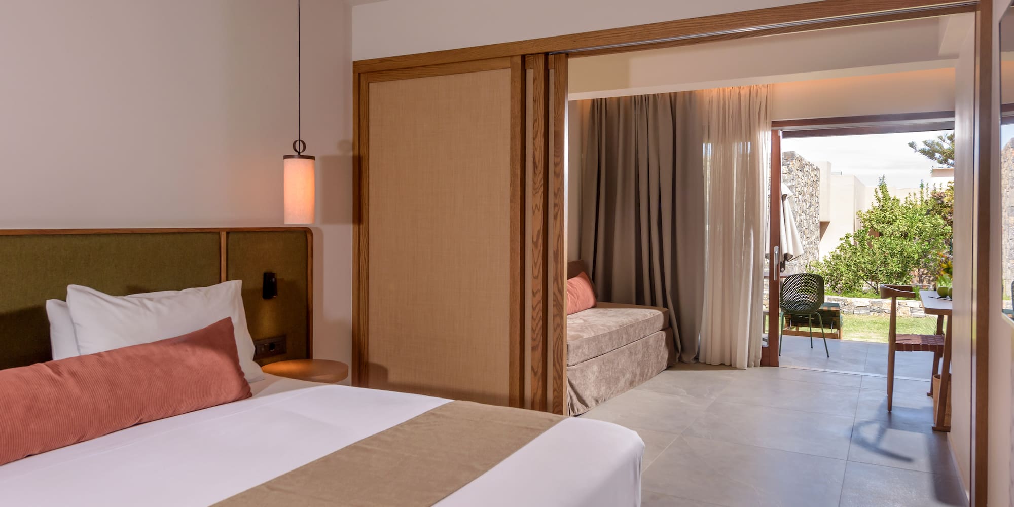 a bedroom with a bed and a sliding door