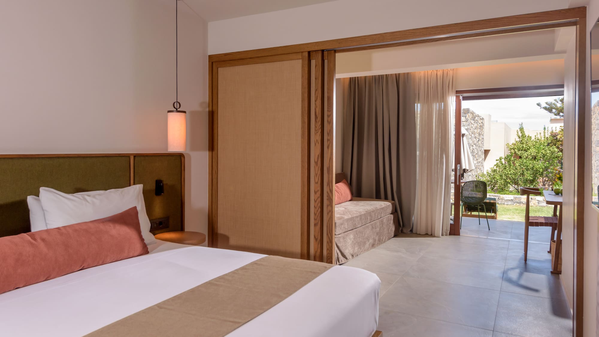 a bedroom with a bed and a sliding door