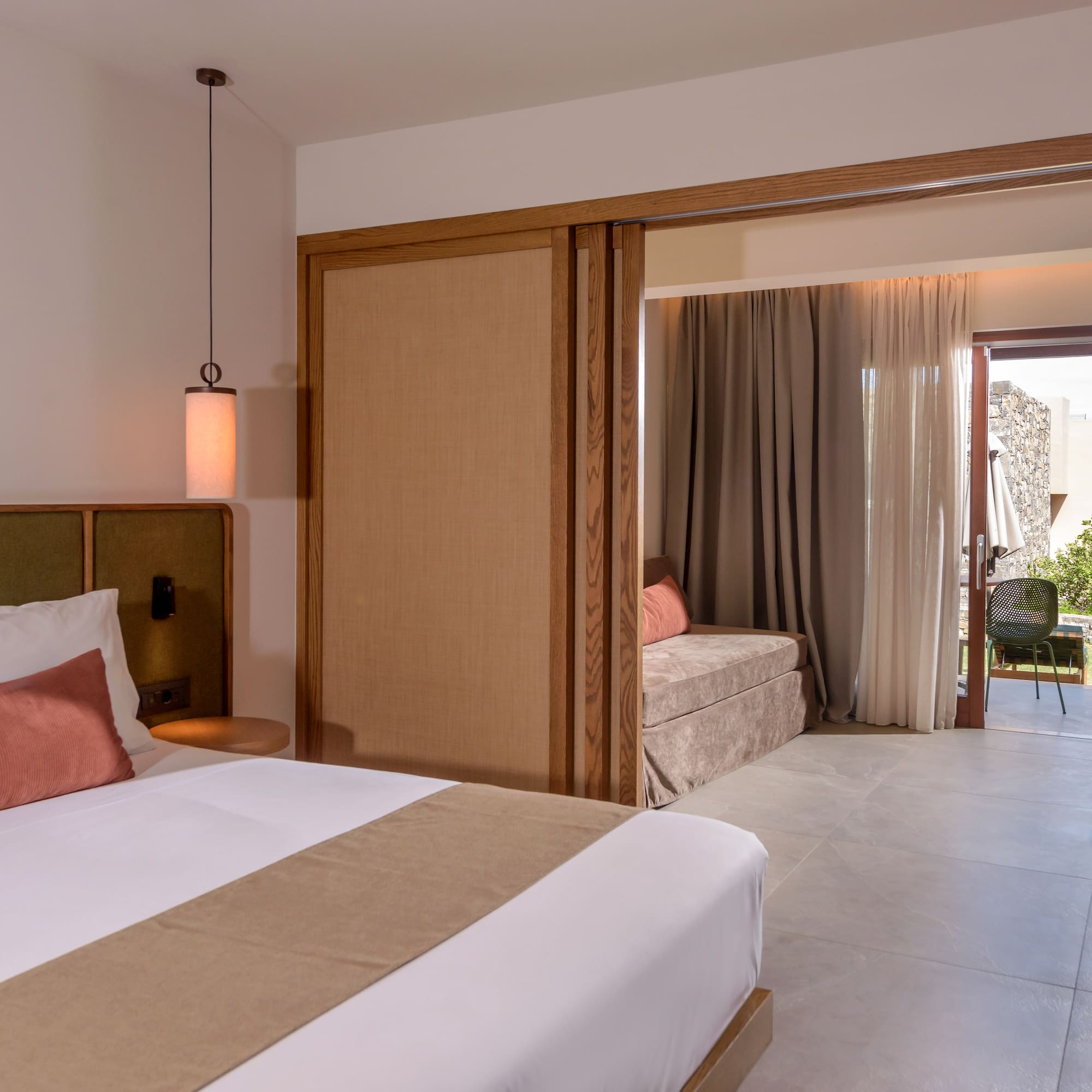 a bedroom with a bed and a sliding door