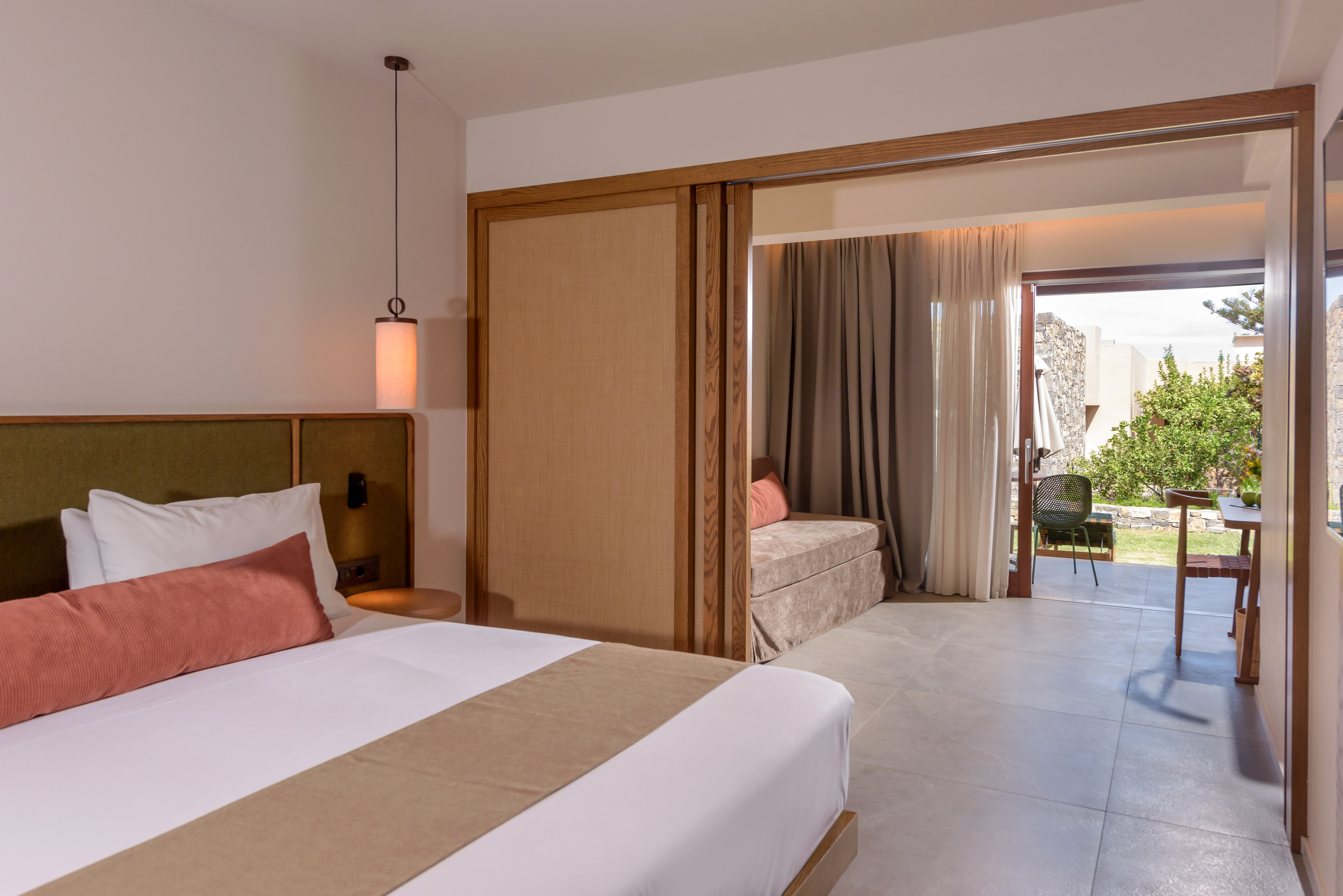 a bedroom with a bed and a sliding door