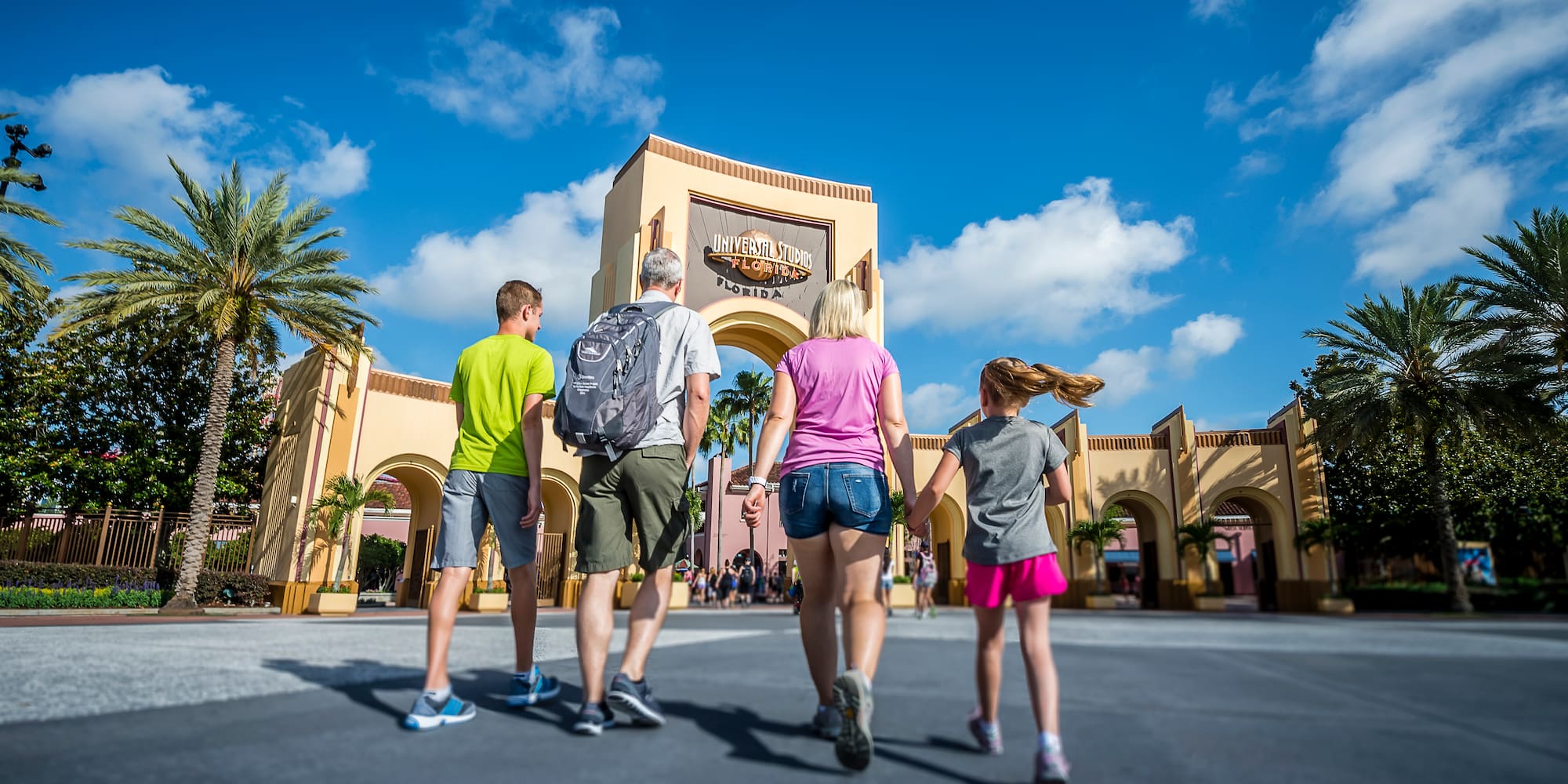 a group of people walking in front of a building